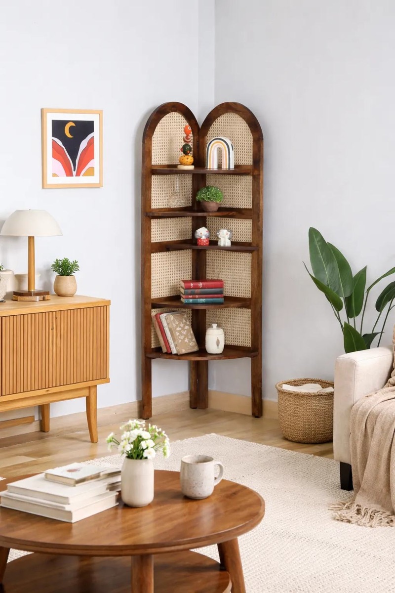 Corner book shelf styled in a living room